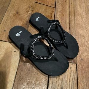 Women’s Sanuk black flip flops
